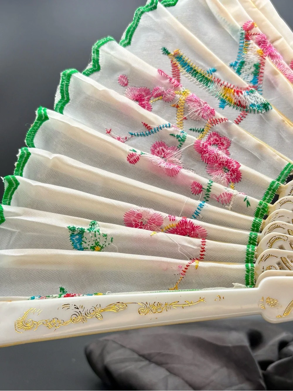 White Embroidered Folding Hand Fan with Pink Floral Design and Green Trim